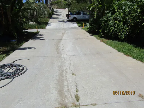 Concrete oil-stain cleaning in progress