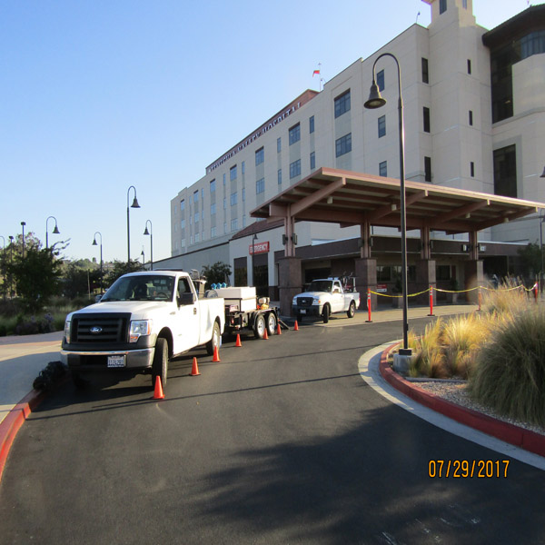 Commercial pressure washing equipment staged for exterior surface cleaning